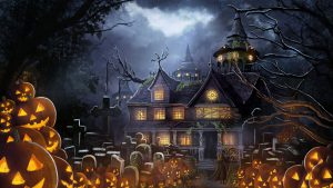 Haunted building with lit pumpkins surrounding front yard