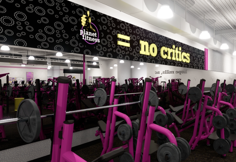 Planet Fitness gym interior showing purple and black workout equipment in a modern fitness facility